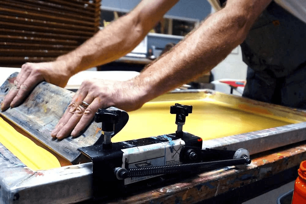 The screen printing press inside the Loveland Graphix shop