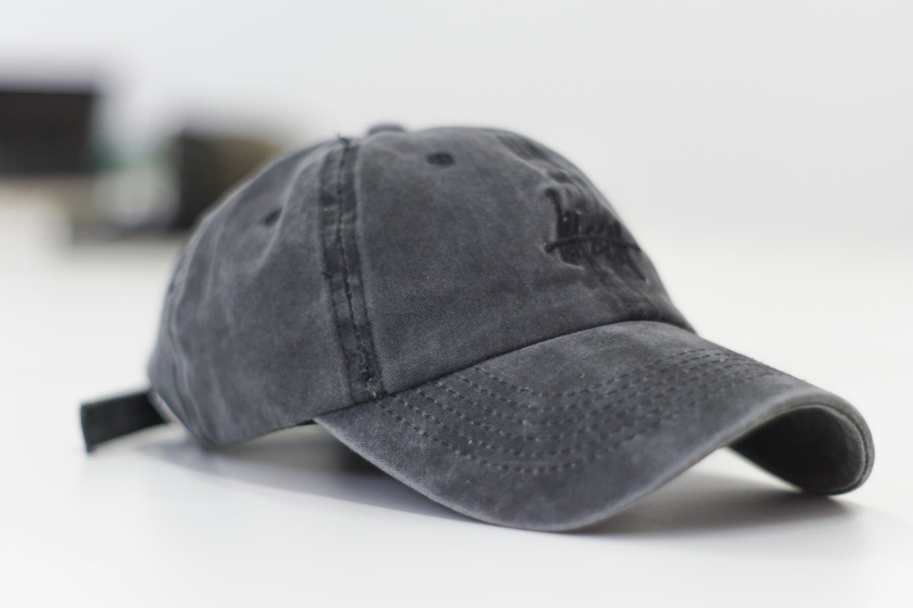 Embroidered gray baseball cap for corporate branding