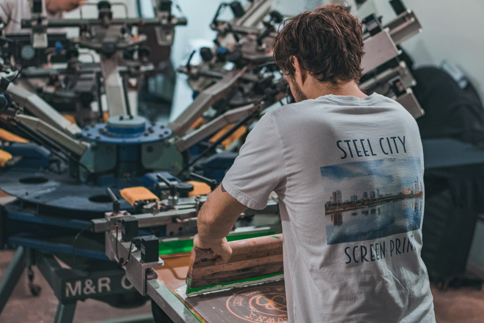 Heat press machine in operation at the print shop