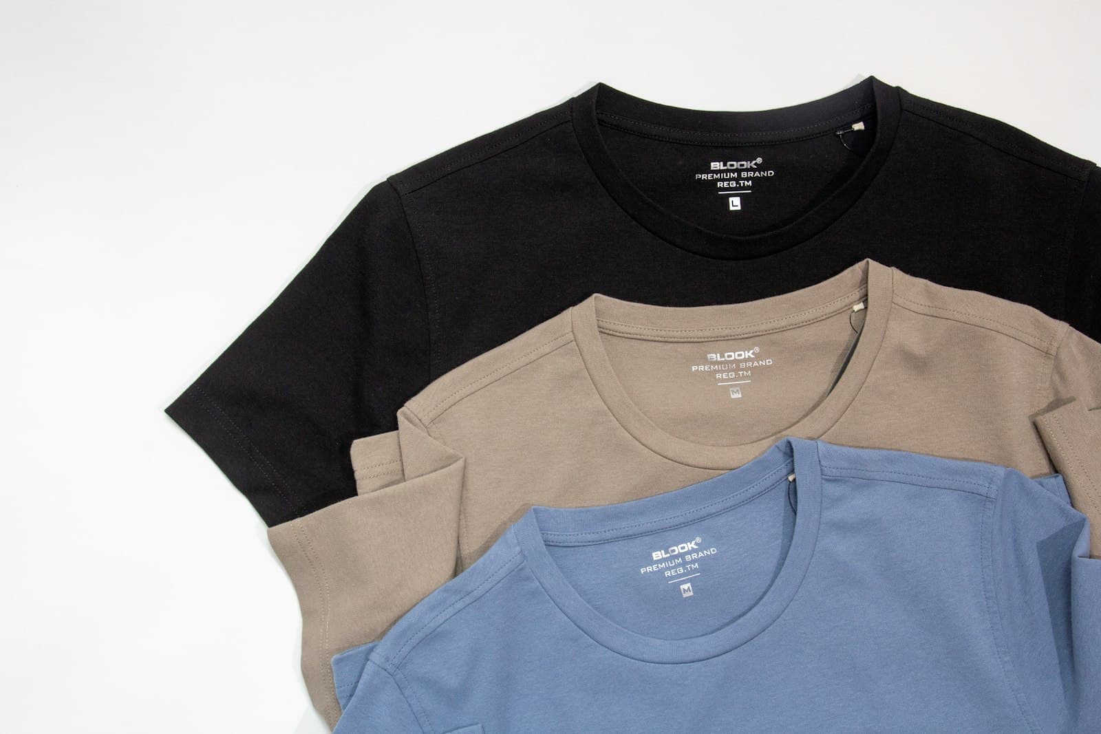 Colorful custom printed t-shirts in white, blue and red